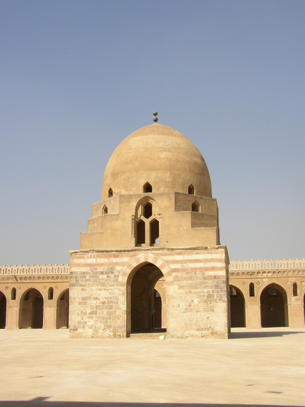 The Mosque of Ibn Tulun in Cairo, Egypt, features ancient architecture styles and decorations created from carved stucco and wood. Photo: Wikimedia Commons
